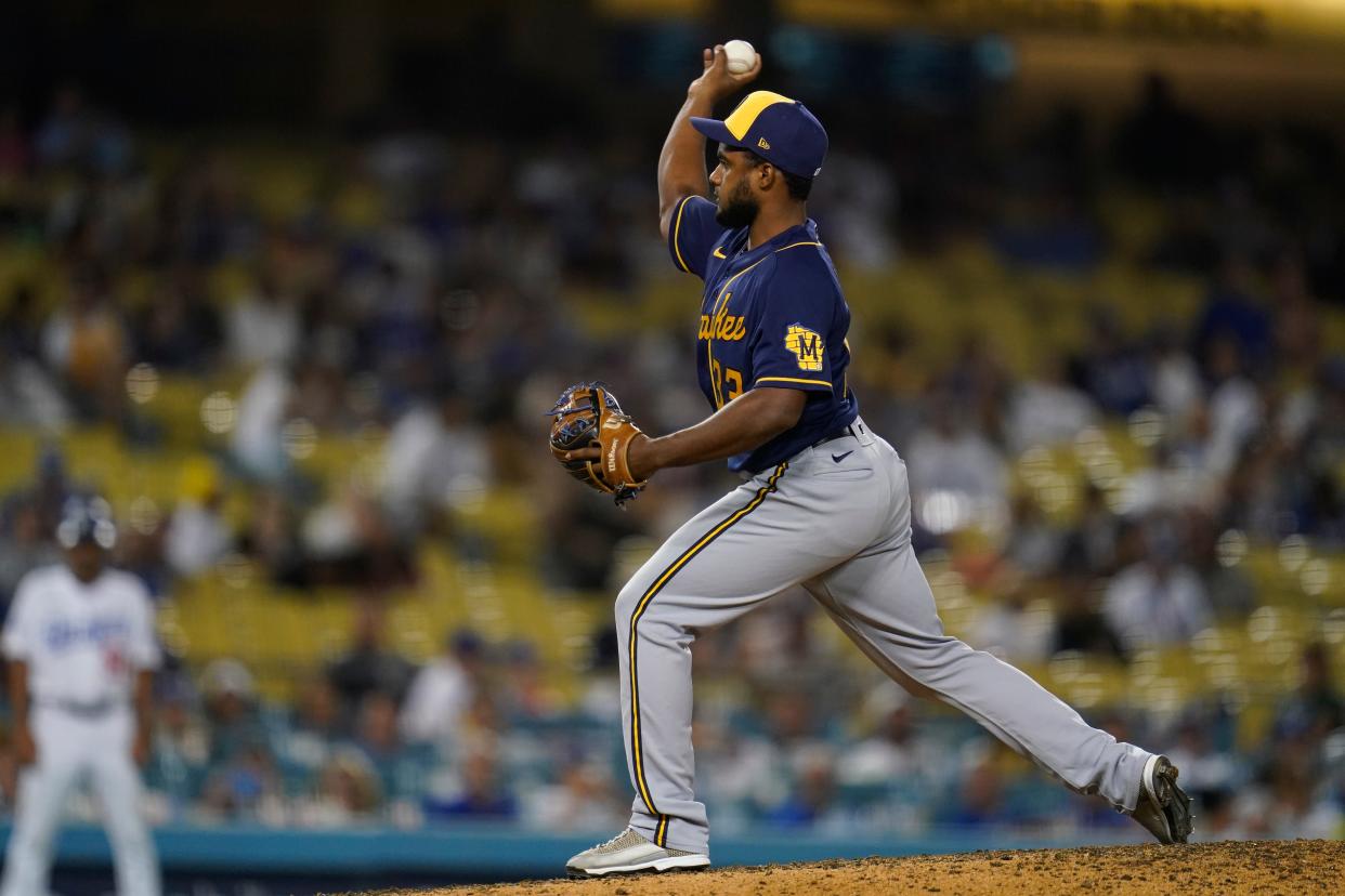 Milwaukee Brewers relief pitcher Pablo Reyes (33) pitches during the eighth inning of a baseball game against the Los Angeles Dodgers in Los Angeles on Aug. 24, 2022.