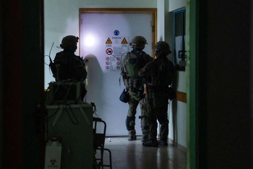 This handout picture released by the Israeli army on November 15, 2023, reportedly shows Israeli soldiers carrying out operations inside Al-Shifa hospital, amid continuing battles betweeen Israel and the Palestinian militant group Hamas.