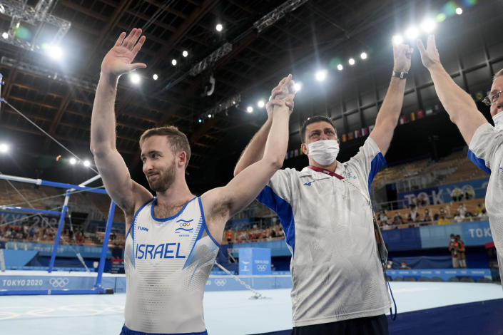 Artem Dolgopyat of Israel, left, celebrates after winning the gold medal on the floor exercise during the artistic gymnastics men's apparatus final at the 2020 Summer Olympics, Sunday, Aug. 1, 2021, in Tokyo. (AP Photo/Natacha Pisarenko)
