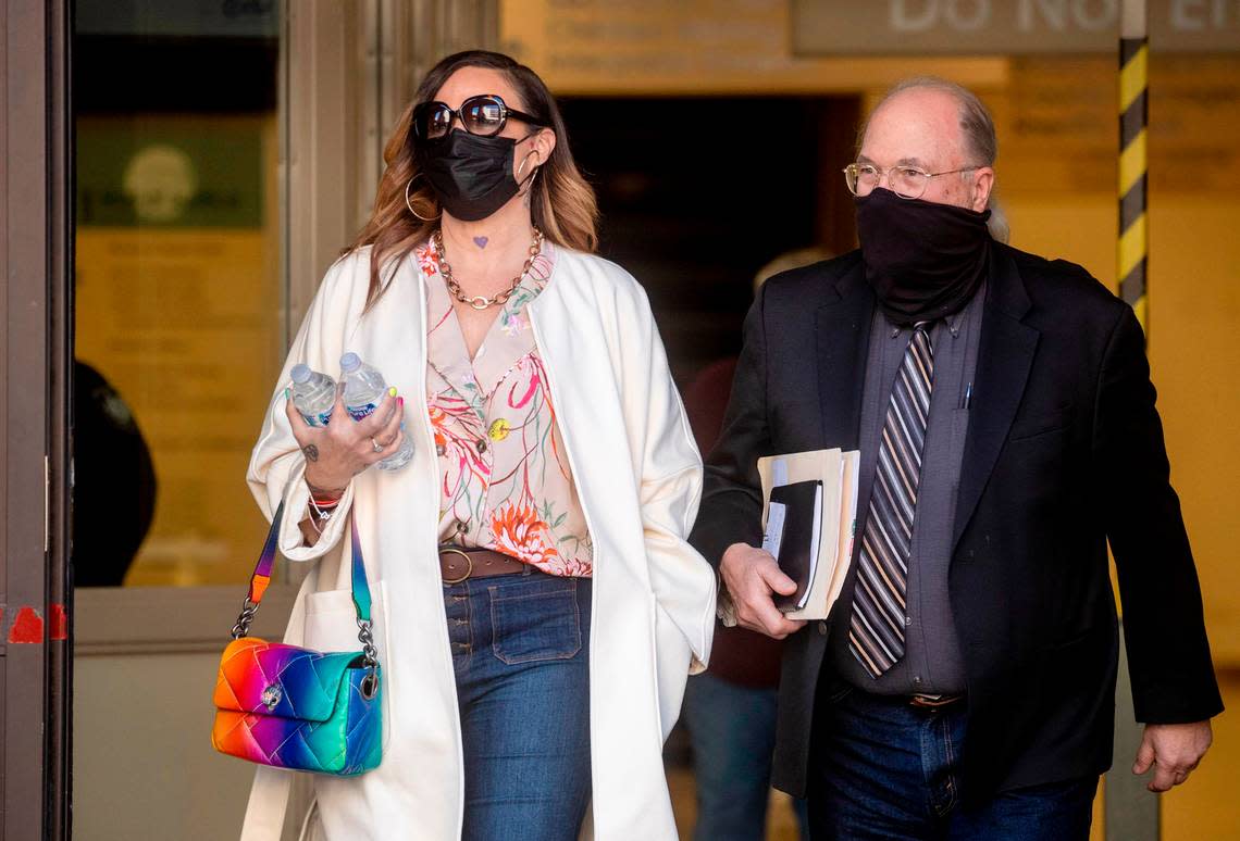 Richelle Nice, known as Juror 7 in the original Scott Peterson trial, leaves the courthouse with her attorney Geoffrey Carr after testifying in an evidentiary hearing, Friday, Feb. 25, 2022. in Redwood City, Calif. Nice, at the heart of convicted murderer Scott Peterson’s retrial bid swore Friday that she had no animosity toward him until after she heard evidence that he had killed his pregnant wife in a case that grabbed worldwide attention in 2004. (Karl Mondon/Bay Area News Group via AP)