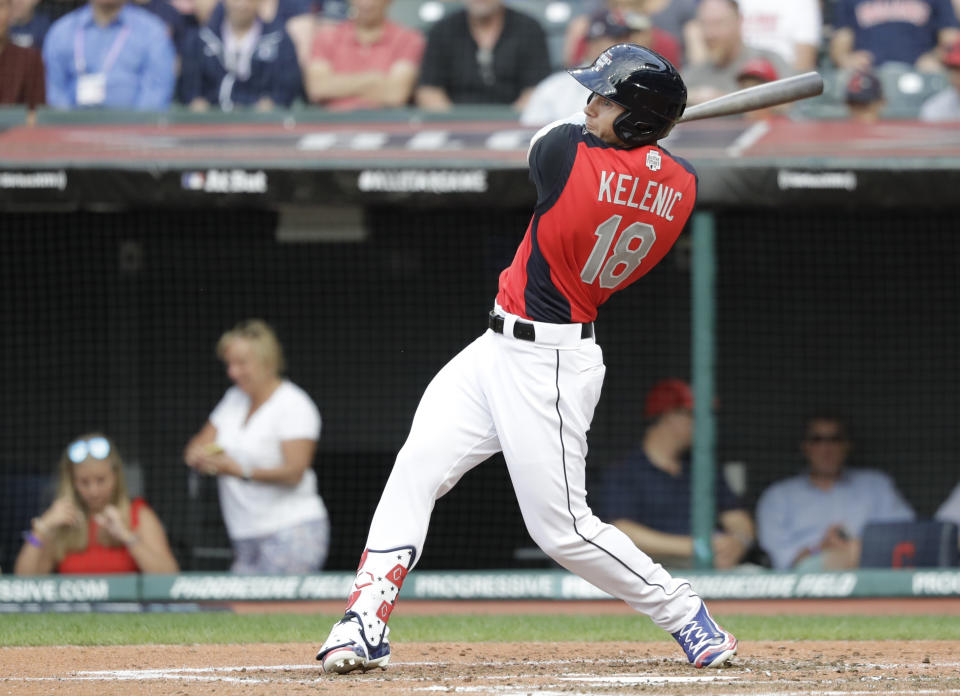 FILE - In this July 7, 2019, file photo, Jarred Kelenic, of the Seattle Mariners, hits during the MLB All-Star Futures baseball game in Cleveland. For a number of rebuilding teams, the 2020 baseball season was supposed to be another step in the progression of their top prospects eventually reaching the big leagues. Seattle Mariners general manager Jerry Dipoto believed Kelenic, one of the top prospects in all of baseball, likely would soon follow to the big leagues, set to join a series of prospects expected to be at the core of rebuilding the franchise. (AP Photo/Darron Cummings, File)