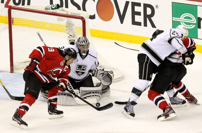  Zach Parise #9 Of The New Jersey Devils Goes For A Loose Puck In Front Of Jonathan Quick #32 Of The Los Angeles Kings  Getty Images