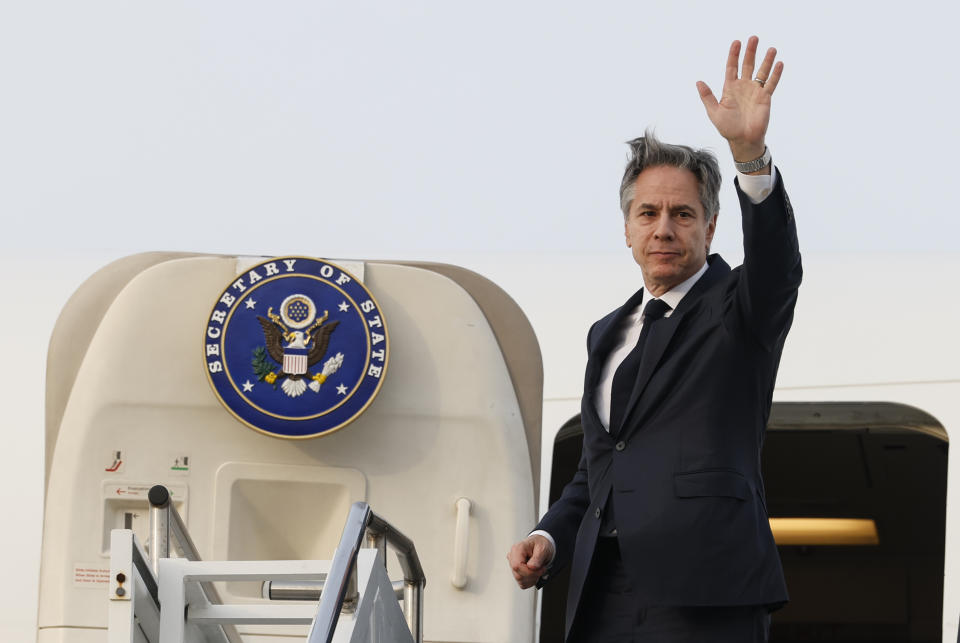 U.S. Secretary of State Antony Blinken waves as he boards an airplane to depart for the Philippines from Osan Air Base, in Pyeongtaek, South Korea, Monday, March 18, 2024. (Evelyn Hockstein/Pool Photo via AP)