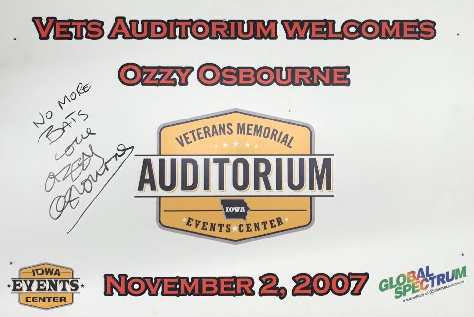 A poster signed by Ozzy Osbourne head of his Nov. 2, 2007, show at Veterans Memorial Auditorium, the venue where he bit the head off a bat in 1982.