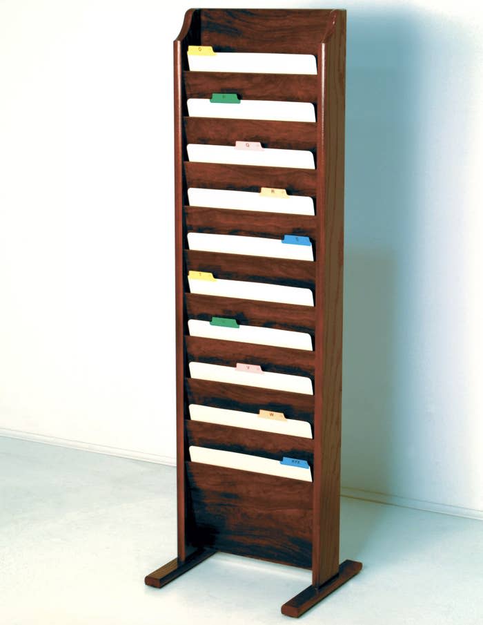 a tall wooden ten compartment paper organizer