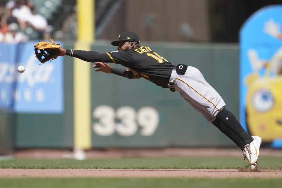 Pittsburgh Pirates third baseman Rodolfo Castro (14) cannot reach an RBI double hit by San Francisco Giants' Wilmer Flores during the fourth inning of a baseball game in San Francisco, Sunday, Aug. 14, 2022. (AP Photo/Jeff Chiu)