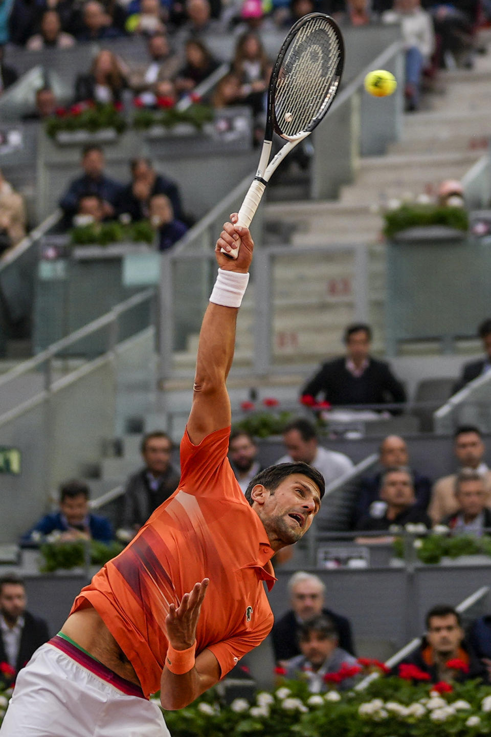 Serbia's Novak Djokovic servers against Gael Monfils, of France, during their match at the Mutua Madrid Open tennis tournament in Madrid, Spain, Tuesday, May 3, 2022. (AP Photo/Manu Fernandez)