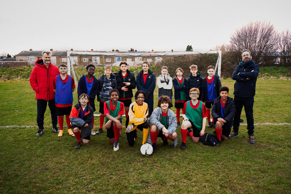 Lee Mack and Hugh Denis with the young ensemble cast playing the Welby Wildcats.