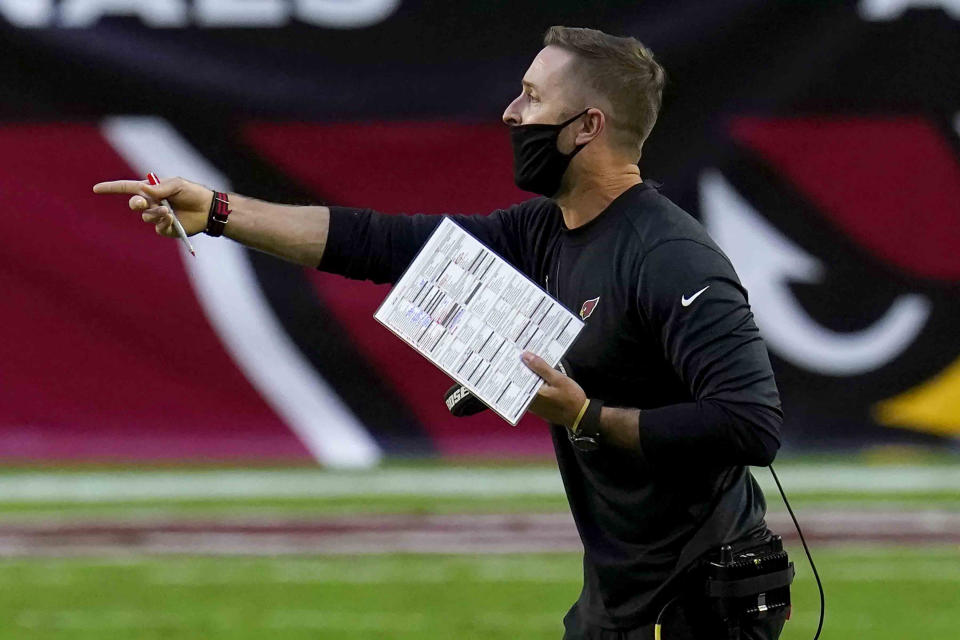 Arizona Cardinals head coach Kliff Kingsbury makes a call during the second half of an NFL football game against the Miami Dolphins, Sunday, Nov. 8, 2020, in Glendale, Ariz. (AP Photo/Ross D. Franklin)