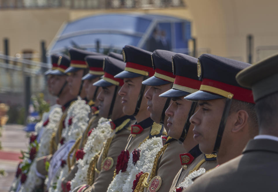 An honor guard stands at attention during the funeral of former autocratic President Hosni Mubarak, at Tantawi Mosque, in eastern Cairo, Egypt, Wednesday, Feb. 26, 2020. Egypt held a full-honors military funeral Wednesday for the country's former autocratic President Hosni Mubarak, who held power for decades before he was ousted in the 2011 Arab Spring uprising that swept much of the region. The 91-year-old Mubarak died on Tuesday. (AP Photo/Hamada Elrasam)