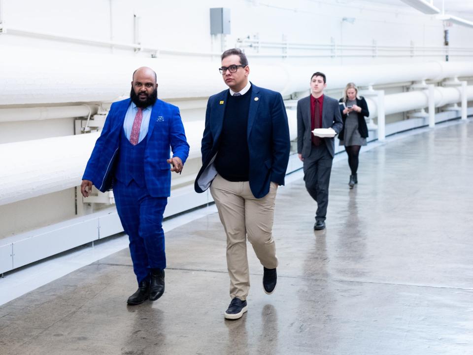 Santos walking through a tunnel beneath the Capitol on Wednesday.