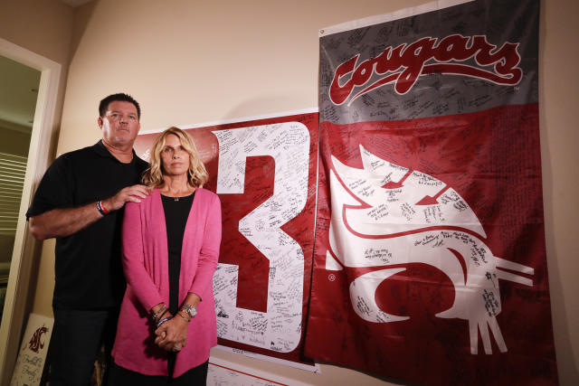 Mark and Kym Hilinski pose for a picture at their home Tuesday, Aug. 21, 2018, in Irvine, Calif. The parents of Washington State quarterback Tyler Hilinski, who killed himself in Pullman, Wash., in January, have become advocates for greater awareness of mental health issues among student-athletes and are channeling their energy into Hilinski&#39;s Hope, a foundation created to bring resources to bear on the issues. (AP Photo/Chris Carlson)