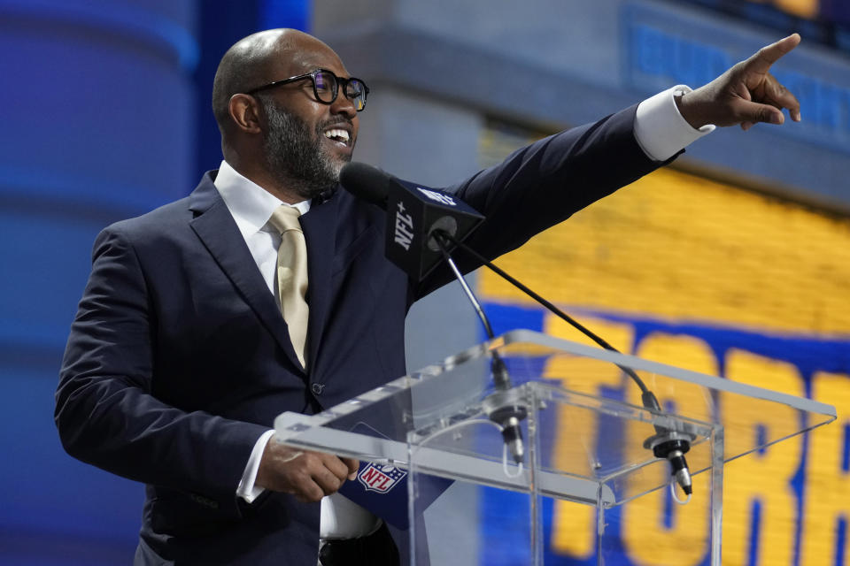 Former football player Torry Holt announces TCU offensive lineman Steve Avila as the Los Angeles Rams selection during the second round of the NFL football draft, Friday, April 28, 2023, in Kansas City, Mo. (AP Photo/Jeff Roberson)