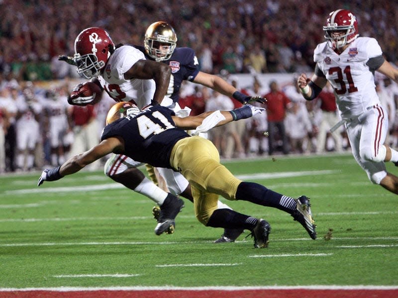 01-07-13 -- Miami Gardens, Fla. -- Alabama running back Eddie Lacy (42) moves across the goal line for a touchdown in the first quarter of the BCS National Championship Game between Alabama and Notre Dame at Sun Life Stadium in Miami Gardens, Fla. Monday, Jan. 7, 2012. (Dusty Compton / Tuscaloosa News)