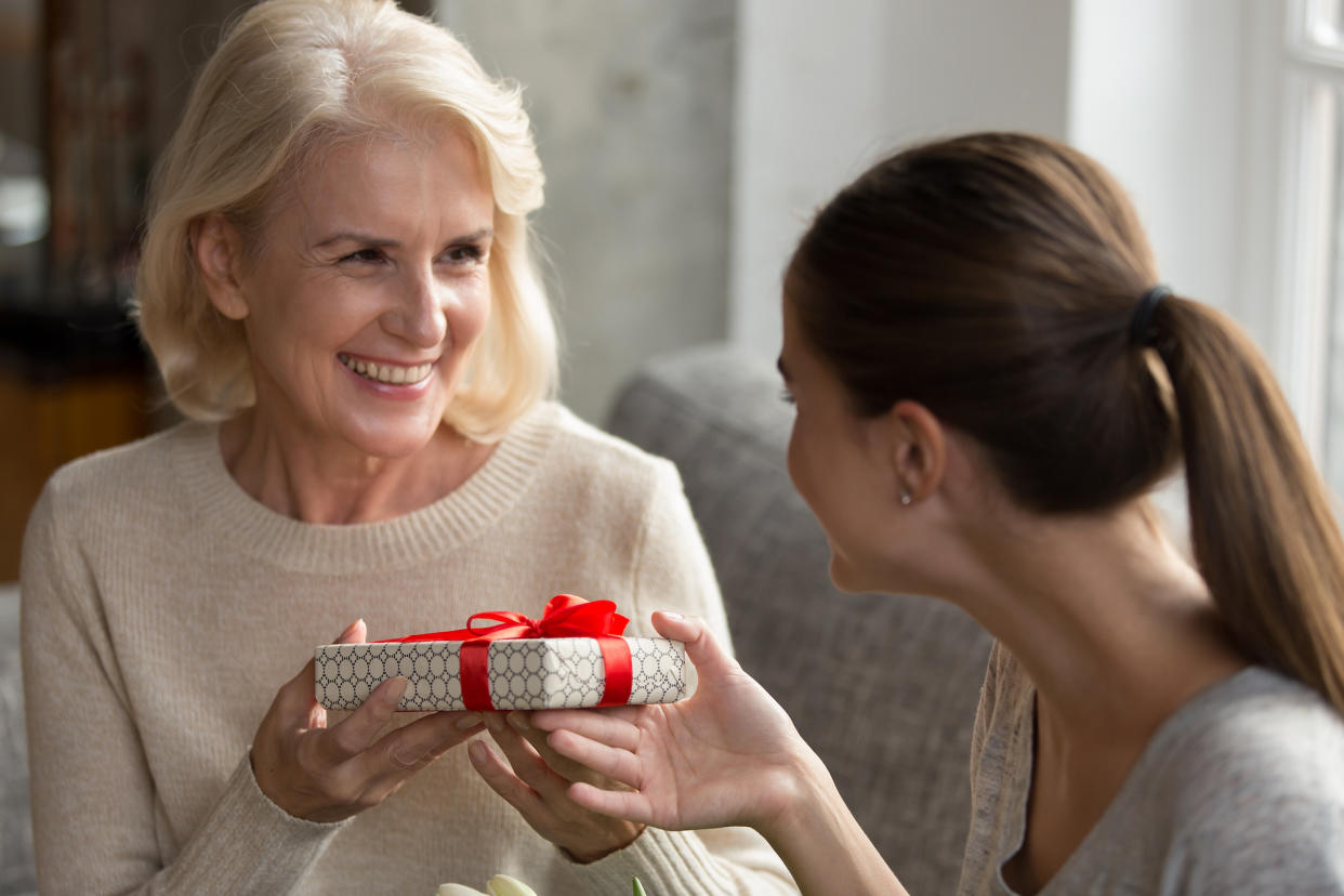 Older-Woman-Getting-Gift-Stock-Photo