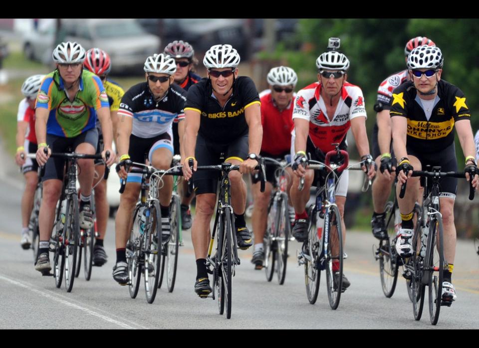 Lance Armstrong (center) leads the pack coming to Jack's restaurant in Pleasant Grove, Ala., Friday, April 27, 2012,, on the fourth day of the Bo Bikes Bama charity bike ride on the one-year anniversary of the deadly Alabama tornadoes. 