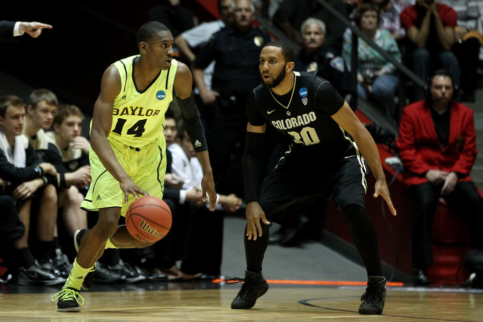 ALBUQUERQUE, NM - MARCH 17: Deuce Bello #14 of the Baylor Bears drives against Carlon Brown #30 of the Colorado Buffaloes in the first half during the third round of the 2012 NCAA Men's Basketball Tournament at The Pit on March 17, 2012 in Albuquerque, New Mexico. (Photo by Christian Petersen/Getty Images)