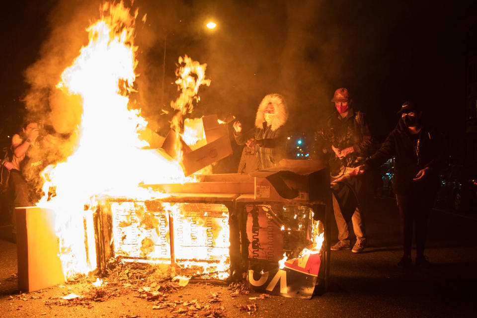 Protesters set a sofa on fire in West Philadelphia during angry scenes. Source: Getty