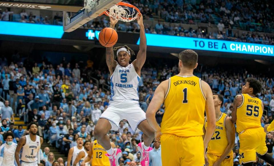 North Carolina’s Armando Bacot (5) gets a dunk during the second half against Michigan on Wednesday, December 1, 2021 at the Smith Center in Chapel Hill, N.C. Bacot scored 11 points in the Tar Heels’ 72-51 victory.