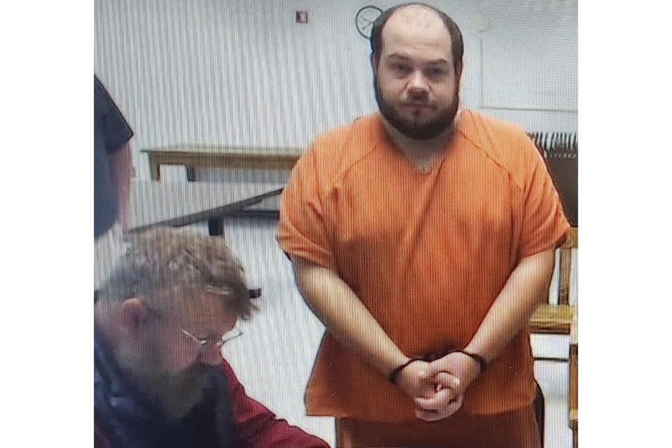 This image taken from a Zoom appearance at the District Court in Havre, Mont., shows Edmund Davis, 36, as he appears before District Court Judge Kaydee Snipes Ruiz, Monday, Nov. 20, 2023, next to his public defender Casey Moore. Davis pleaded not guilty to two counts of sexual abuse of children for images that were found on a cellphone in his apartment. Arizona officers got a warrant to search his phone as they were investigating how Alicia Navarro, who disappeared from her home in Arizona four years ago, ended up living with Davis in north-central Montana. (AP Photo/Amy Beth Hanson)