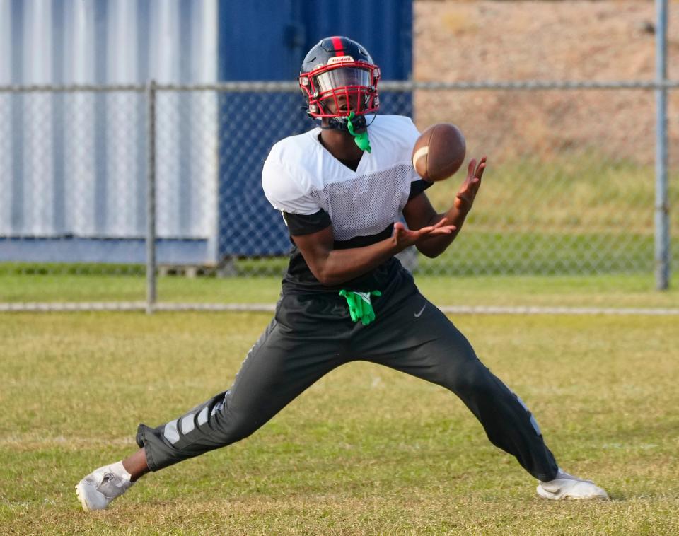 November 1, 2022; Peoria, Ariz; USA; Centennial defensive end Noah Carter receives a punt during a practice at Centennial High School.