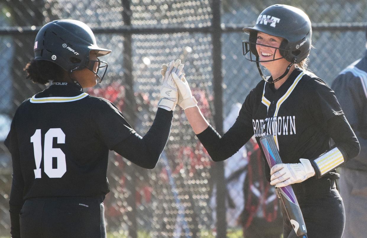 Bordentown's Brianna Fischer, right, is congratulated by teammate Kaci Benton after Fischer scored a run during the 5th inning of the softball game between Bordentown and Kingsway played at Kingsway Regional High School in Woolwich Township on Thursday, April 28, 2022.  Bordentown defeated Kingsway, 5-3.