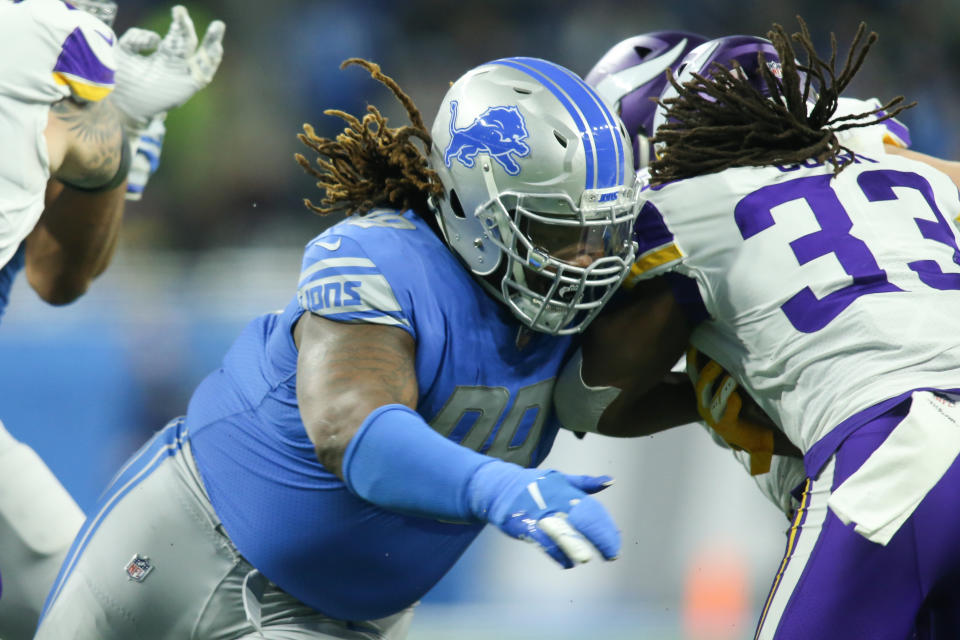 DETROIT, MI - DECEMBER 23:  Detroit Lions defensive tackle Damon Harrison, Sr. (98) tackles Minnesota Vikings running back Dalvin Cook (33) during a regular season game between the Minnesota Vikings and the Detroit Lions on December 23, 2018 at Ford Field in Detroit, Michigan.  Minnesota defeated Detroit 27-9.  (Photo by Scott W. Grau/Icon Sportswire via Getty Images)