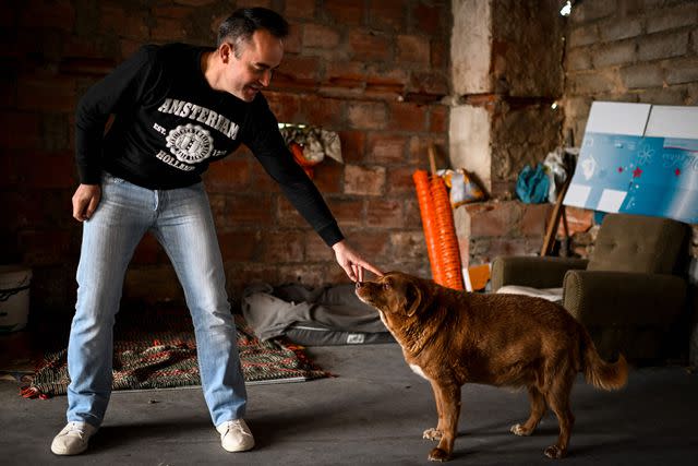 <p>PATRICIA DE MELO MOREIRA/AFP via Getty </p> eonel Costa, 38 years old, owner of Bobi, a 30 years old Portuguese dog that has been declared the world's oldest dog by Guinness World Records, caresses his pet at their home in the village of Conqueiros near Leiria.