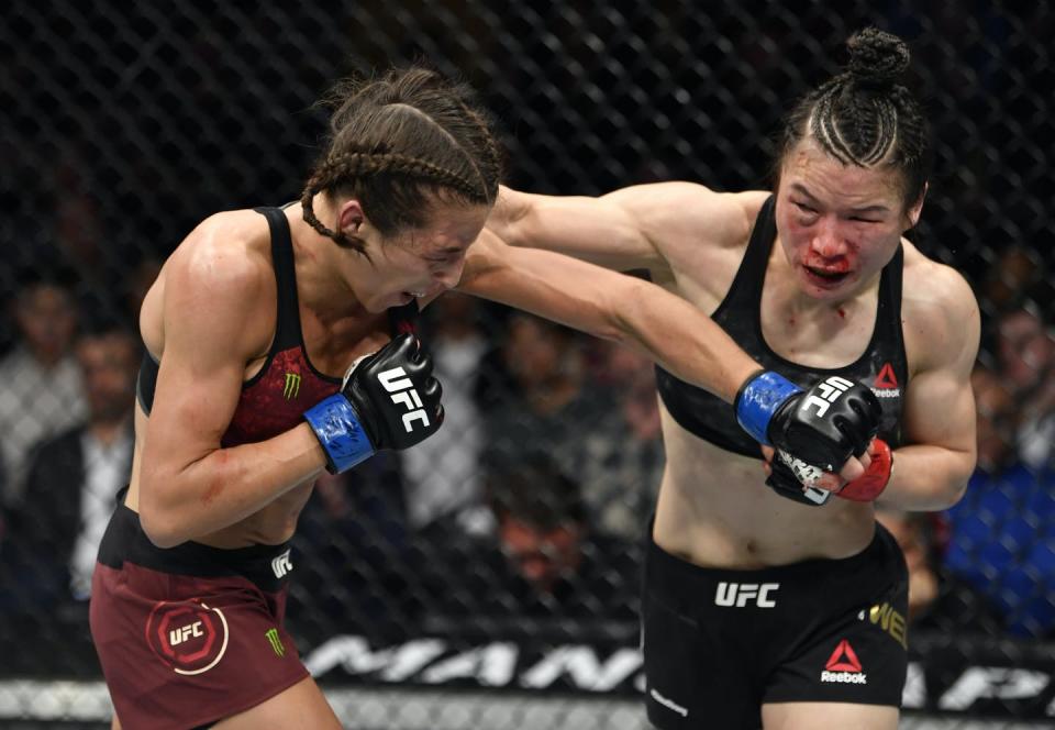 <span class="caption">China's Zhang Weili, on the right, has helped grow the popularity of the UFC in her native country.</span> <span class="attribution"><a class="link " href="https://www.gettyimages.com/detail/news-photo/joanna-jedrzejczyk-of-poland-punches-zhang-weili-of-china-news-photo/1211078855?adppopup=true" rel="nofollow noopener" target="_blank" data-ylk="slk:Jeff Bottari/Zuffa LLC via Getty Images;elm:context_link;itc:0;sec:content-canvas">Jeff Bottari/Zuffa LLC via Getty Images</a></span>