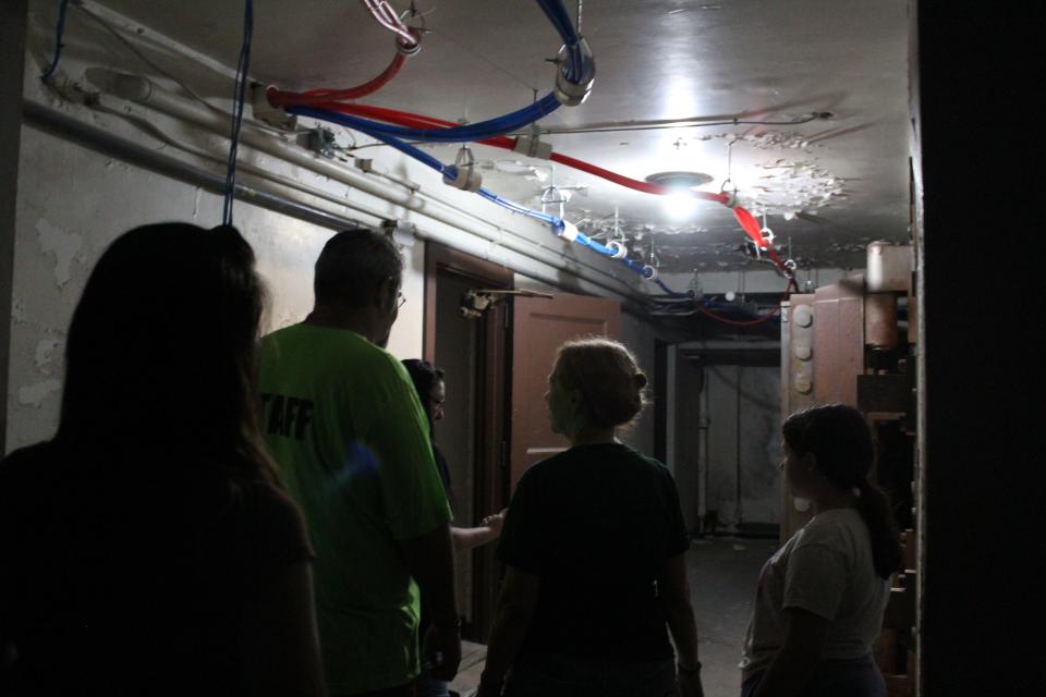 Brandy Gleason of Guiding Light Healing Therapies based in Kentucky leads a paranormal investigation at WreckCreations inside the old bank building  to prepare for the Chillicothe Ghost Walk on August 12, 2023.