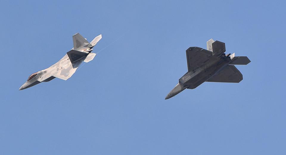 Two U.S. Air Force F-22 Raptors fly side-by-side near Patrick Space Force Base on Thursday morning.