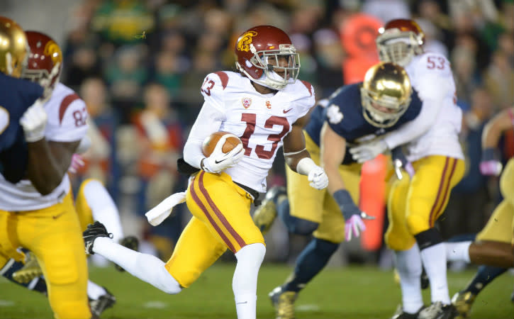 Oct 19, 2013; South Bend, IN, USA; Southern California Trojans cornerback Kevon Seymour (13) carries the ball on a kickoff return against the Notre Dame Fighting Irish at Notre Dame Stadium. Mandatory Credit: Kirby Lee-USA TODAY Sports