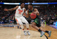 <p>King McClure #3 of the Baylor Bears drives against Oshae Brissett #11 of the Syracuse Orange during the first half in the first round of the 2019 NCAA Men’s Basketball Tournament at Vivint Smart Home Arena on March 21, 2019 in Salt Lake City, Utah. </p>