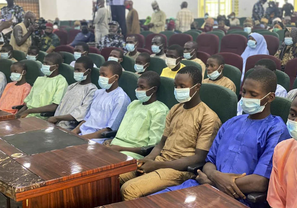 Students and teachers who were abducted by gunmen from the Government Science College Kagara two weeks ago are seen after their release meeting with the state Governor Abubakar Sani Bello, in Minna, the capital of Niger state, in Nigeria Saturday, Feb. 27, 2021. Their release was announced a day after police said gunmen had abducted more than 300 girls Friday from a boarding school elsewhere in northern Nigeria, in Zamfara state. (AP Photo)