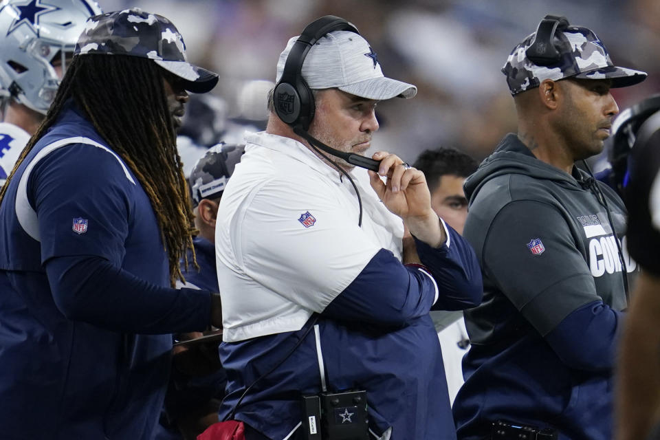 Dallas Cowboys head coach Mike McCarthy, center, looks on from the sideline during the first half of a preseason NFL football game against the Los Angeles Chargers Saturday, Aug. 20, 2022, in Inglewood, Calif. (AP Photo/Ashley Landis)