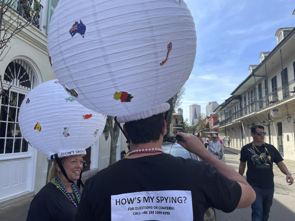 Jerome FitzGibbons of New Orleans walks the streets of the French Quarter on Mardi Gras, costumed as a Chinese spy balloon on Tuesday, Feb. 21, 2023. (AP Photo/Kevin McGill)