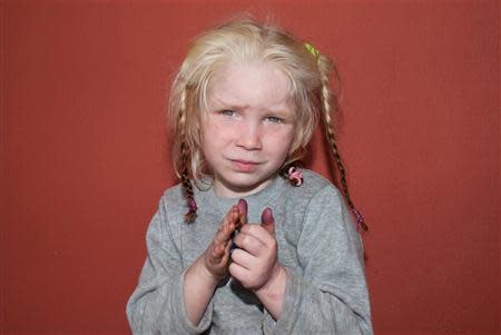 A four-year-old girl, found living with a Roma couple in central Greece, is seen in a handout photo distributed by the Greek police and obtained by Reuters October 18, 2013. REUTERS/Greek Police/Handout