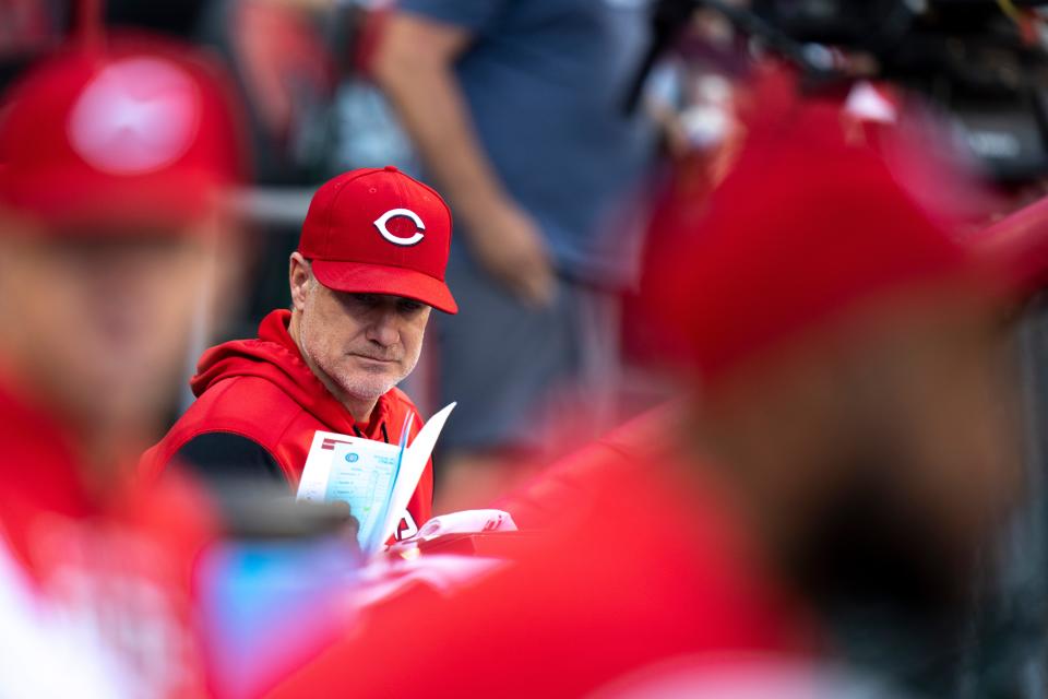Cincinnati Reds manager David Bell sits in the dugout in the game with the Chicago Cubs at Great American Ball Park on Wednesday.