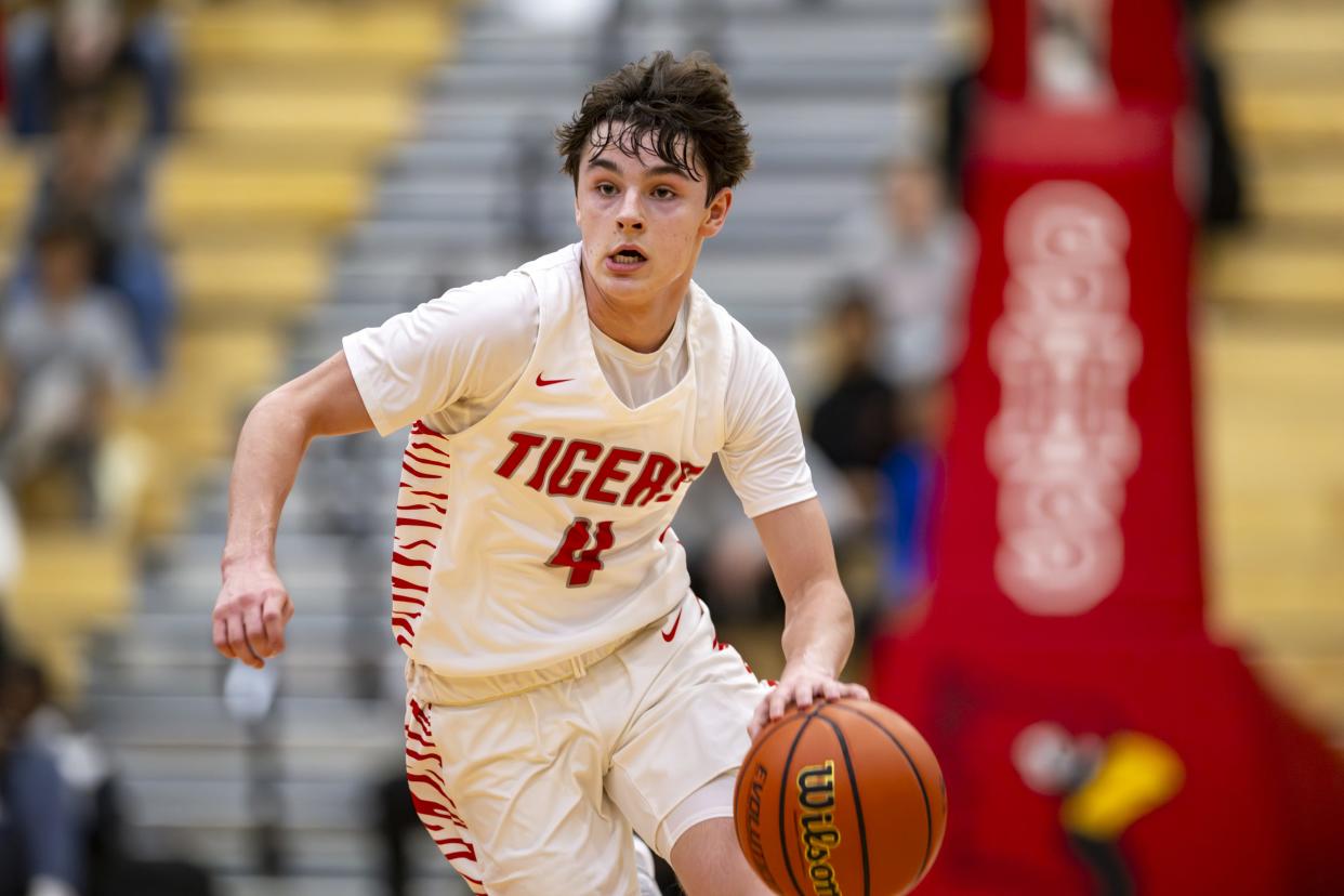 Fishers High School freshman Cooper Zachary (4) races the ball up court during the first half of a game in the Forum Tipoff Classic against Kokomo High School, Saturday, Dec. 9, 2023, at Southport High School.