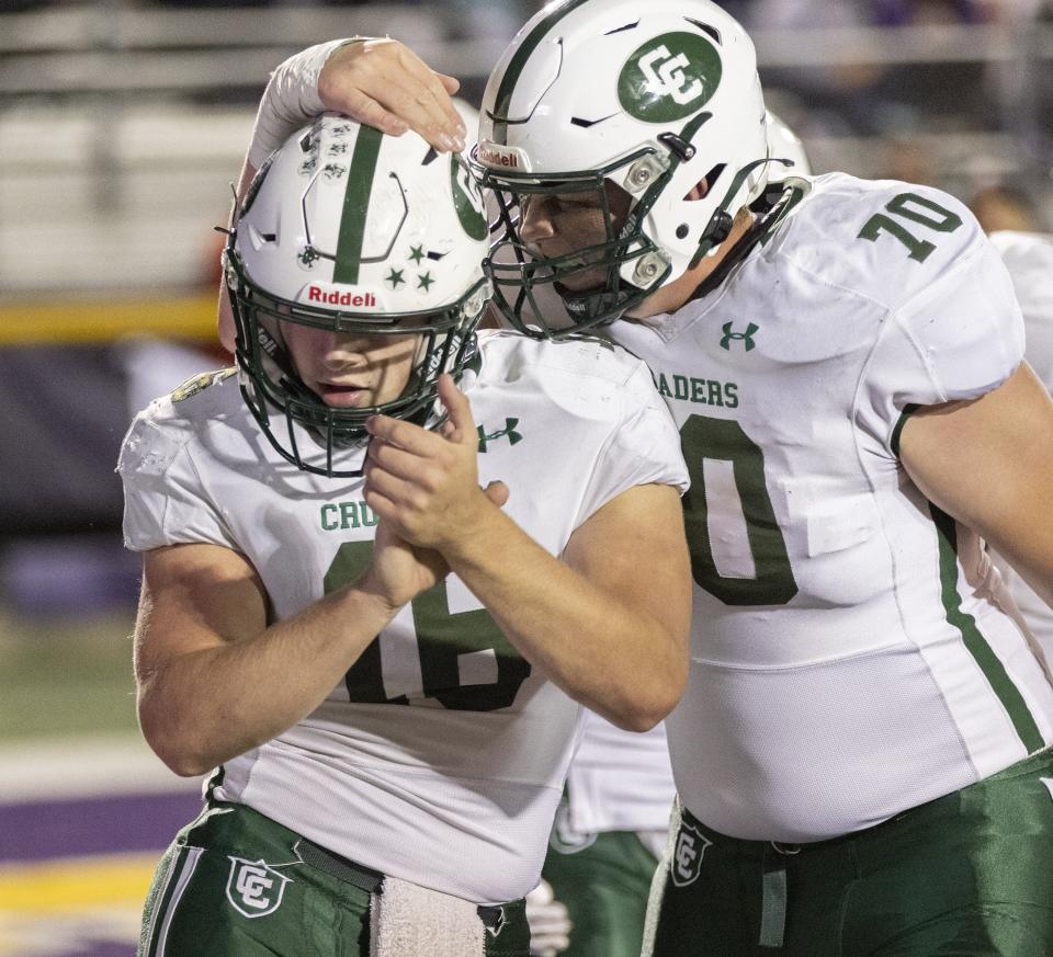 Central Catholic quarterback Jack Talkington (16) and Jonathan Stangl celebrate a first-quarter touchdown against Jackson on Friday, Oct. 14, 2022.