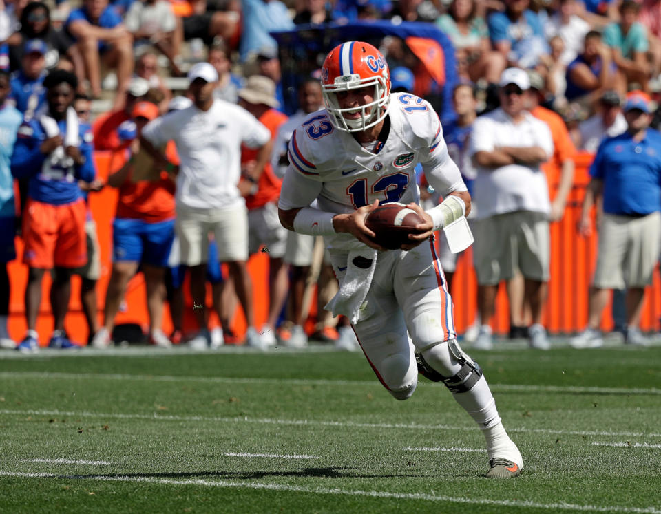 Florida quarterback Feleipe Franks runs with the ball during an NCAA spring college football intrasquad game, Saturday, April 14, 2018, in Gainesville, Fla. (AP Photo/John Raoux)