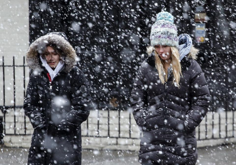 <p>Women walk on a street as snow falls during winter storm Quinn on March 7, 2018 in Hoboken, N.J. This is the second nor’easter to hit the area in a week, and is expected to bring heavy snowfall and winds, raising fears of another round of electrical outages. (Photo: Kena Betancur/Getty Images) </p>