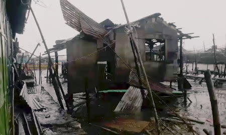 A damaged house is seen after Typhoon Mangkhut hits Philippines, Bolinao, Pangasinan, Philippines September 15, 2018 in this still image obtained from a social media video. DAEVE DEL FIERRO/via REUTERS