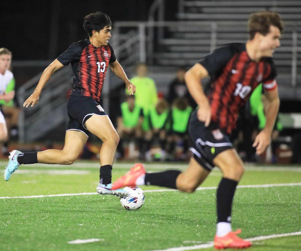 New Smyrna Hugues Iguaran (13) dribbles the ball down the field during Monday night’s game against Spruce Creek November 27th, 2023.