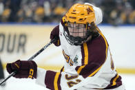 FILE - Minnesota forward Logan Cooley plays against Quinnipiac during the first period of the championship game in the Frozen Four NCAA college hockey tournament April 8, 2023, in Tampa, Fla. Cooley was the third pick in the 2022 NHL hockey draft by the Arizona Coyotes. (AP Photo/Chris O'Meara, File)