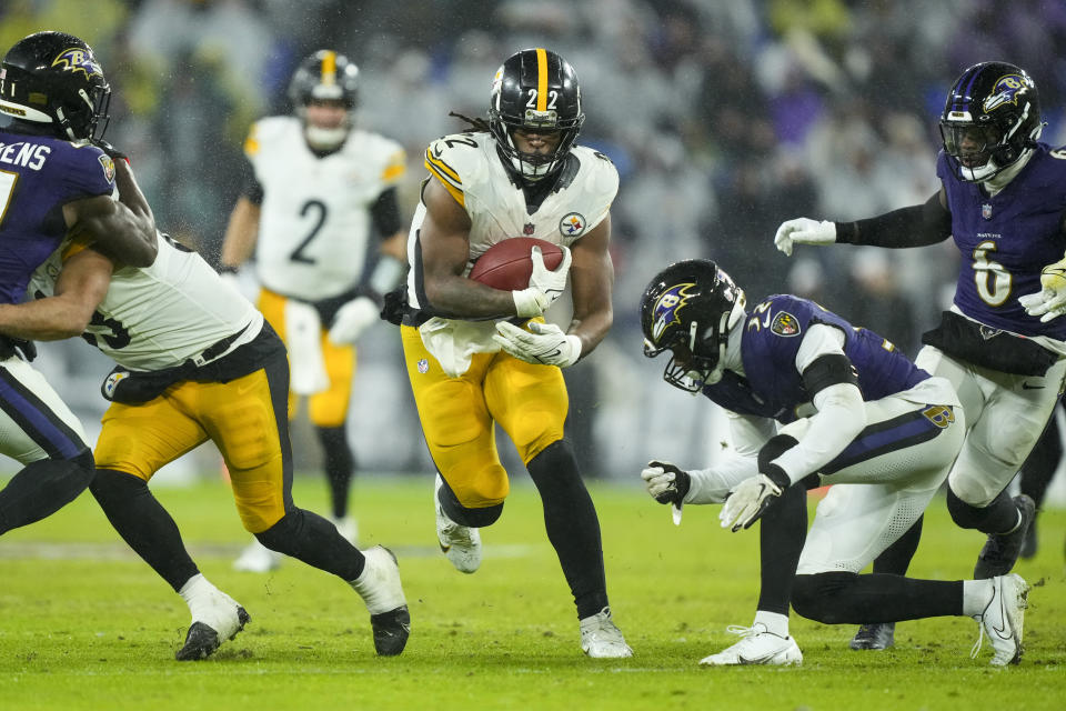 Pittsburgh Steelers running back Najee Harris (22) runs with the ball against the Baltimore Ravens during the second half of an NFL football game, Saturday, Jan. 6, 2024 in Baltimore. (AP Photo/Matt Rourke)