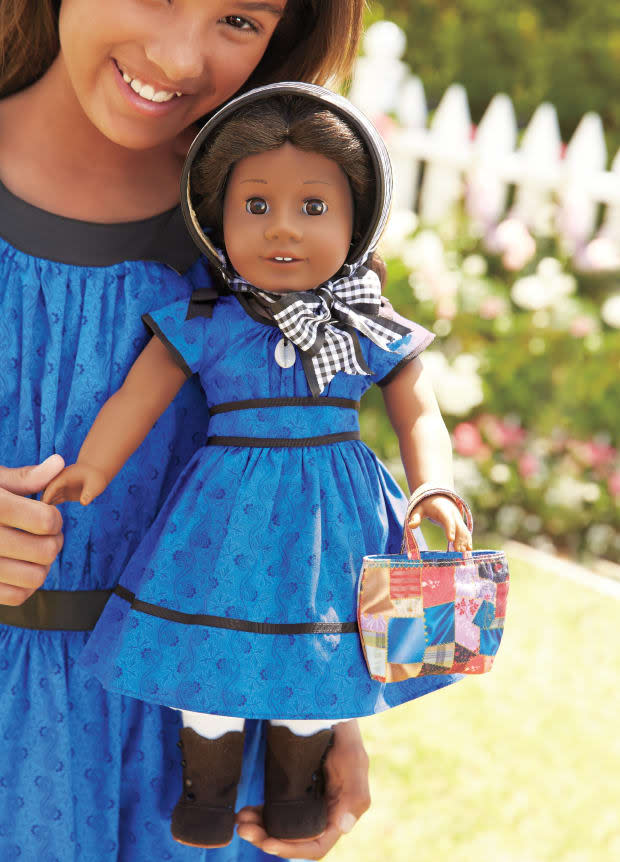 Addy wears an "authentic 1864 outfit," complete with a faux cowrie shell necklace, which, according to her story, had belonged to her great-grandmother.