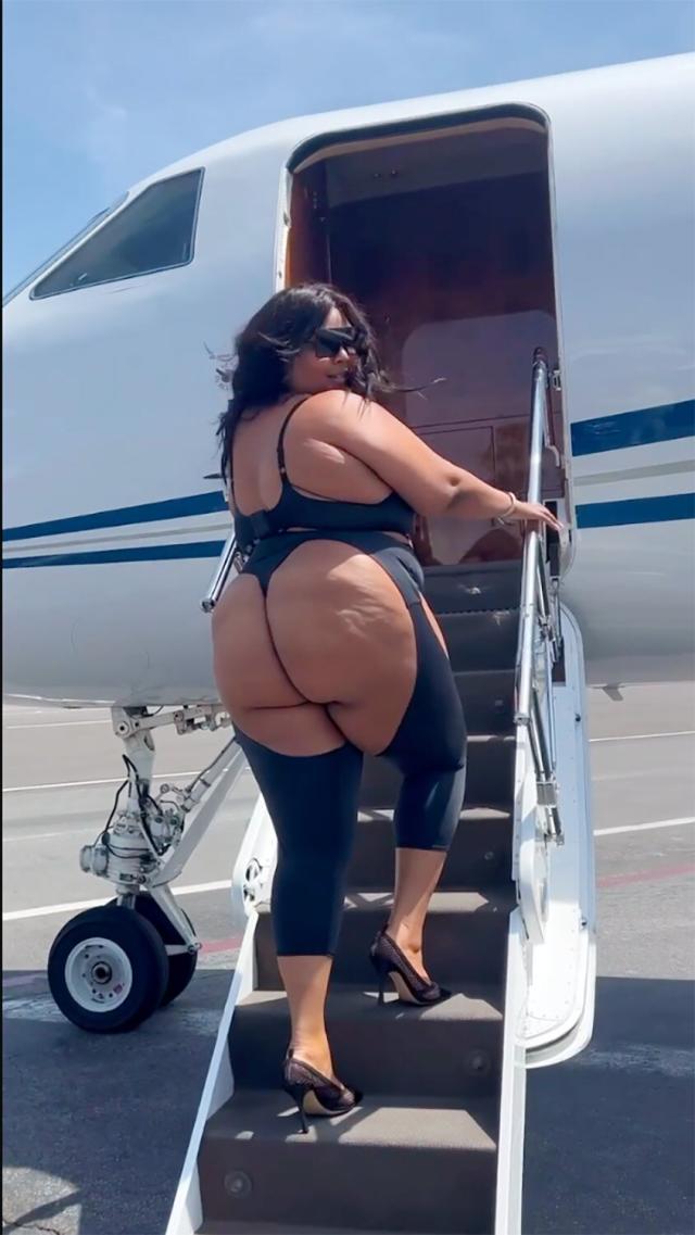 Lizzo Bares Almost All as She Boards a Private Jet in Shapewear