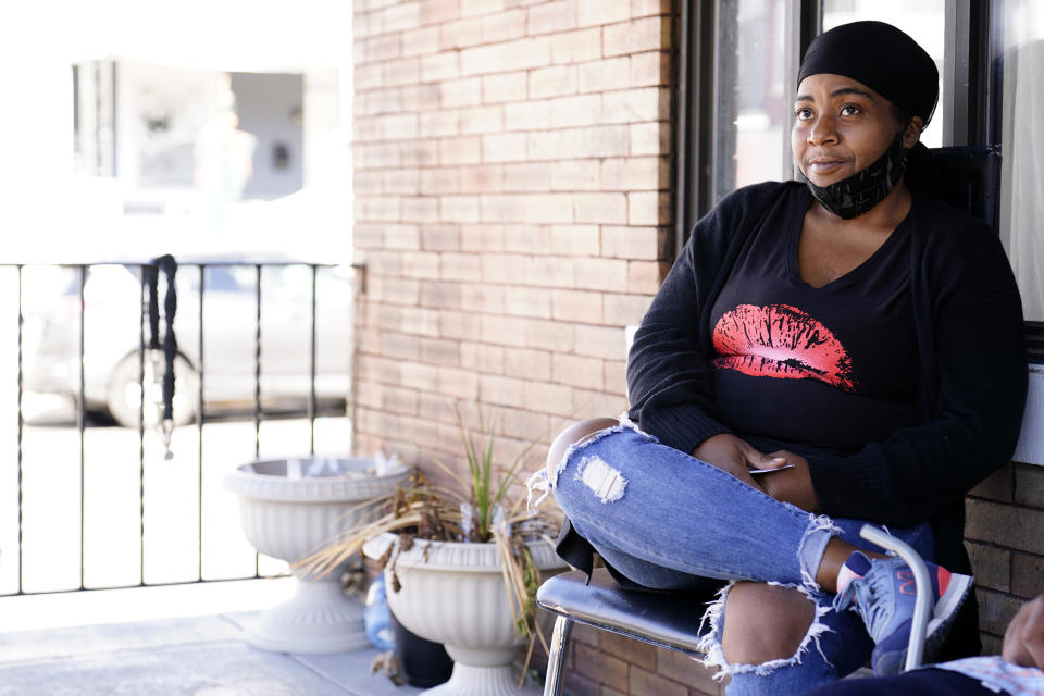 Philadelphia resident Latoya Ratcliff pauses while talking with The Associated Press outside her home, Wednesday, Oct. 14, 2020, in west Philadelphia. Philadelphia has been the cornerstone of Democratic victories in the battleground state — producing Democratic margins so massive that winning statewide has been longshot for most Republicans. But it's a longshot Donald Trump pulled off in 2016 and is trying to repeat again. (AP Photo/Matt Slocum)