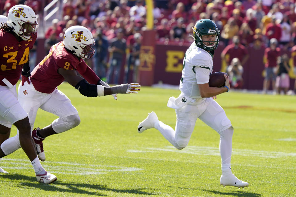 Baylor quarterback Blake Shapen, right, runs from Iowa State linebacker O'Rien Vance (34) and defensive end Will McDonald IV (9) during the first half of an NCAA college football game, Saturday, Sept. 24, 2022, in Ames, Iowa. (AP Photo/Charlie Neibergall)